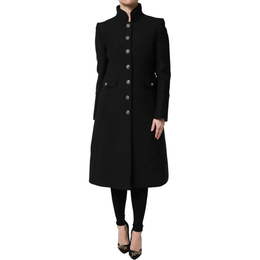 Dolce & Gabbana black wool trench coat jacket, single-breasted, with button closure and logo details, worn by a model.