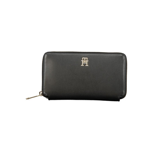Tommy Hilfiger Black Polyethylene Wallet with zip closure, 4 compartments, coin purse, card spaces, and logo.