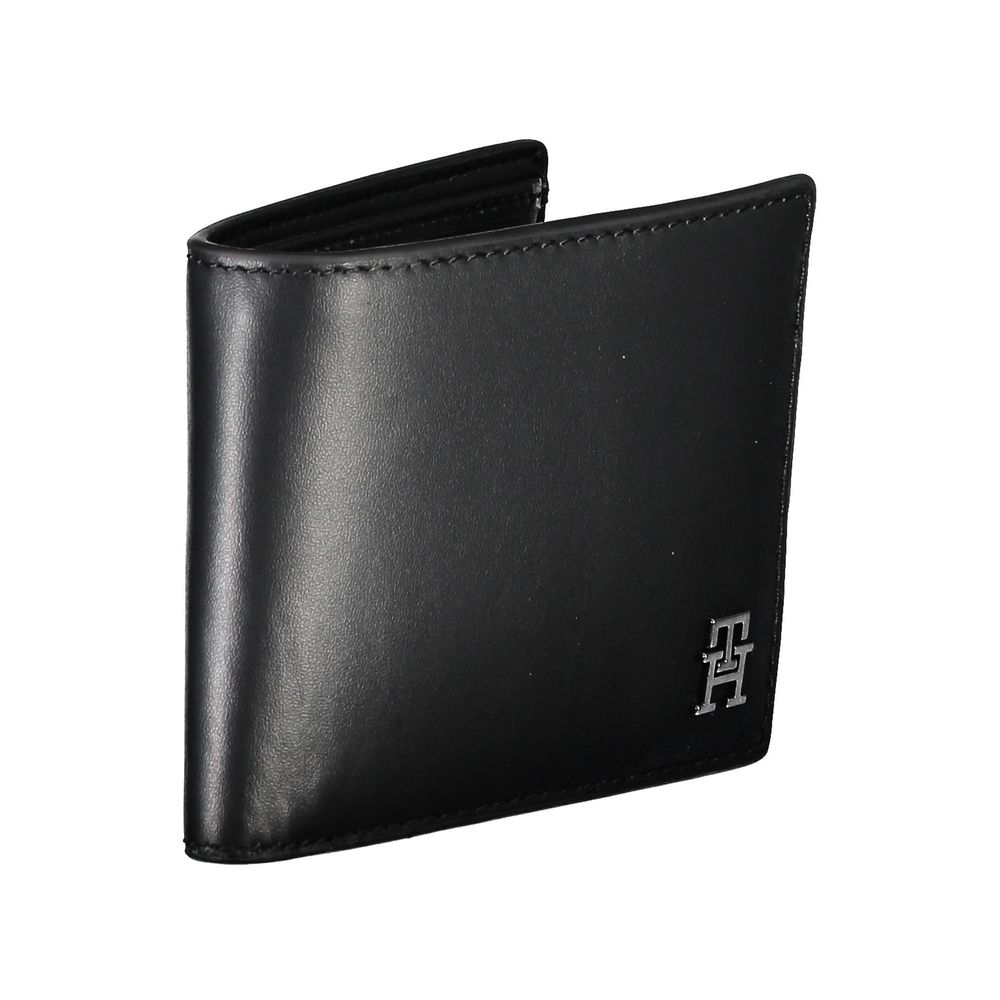 Tommy Hilfiger Black Leather Men Wallet with iconic logo, sleek design, and card spaces.