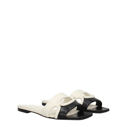 Valentino Garavani Black Leather Slippers with open toe design and ivory accents, casual style, low flat heel.