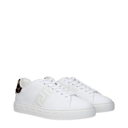 Versace White Leather Low Top Sneakers with front, side, and back logos, lace-up closure, rubber sole, round toe, low flat heel.