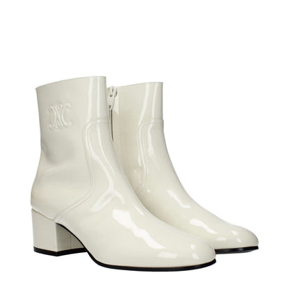 Celine Beige Leather Ankle Boots with zip closure, round toe, and mid heels. Patent finish, side logo, and leather sole. Casual style.