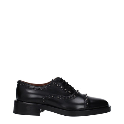 Valentino Garavani Black Leather Oxfords And Derbies with studs, lace-up design, mid heel, leather sole, round toe, perfect for casual style.