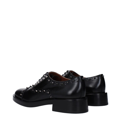 Valentino Garavani Black Leather Oxfords And Derbies with studs, round toe, mid heels, lace-up closure, casual style, leather sole.