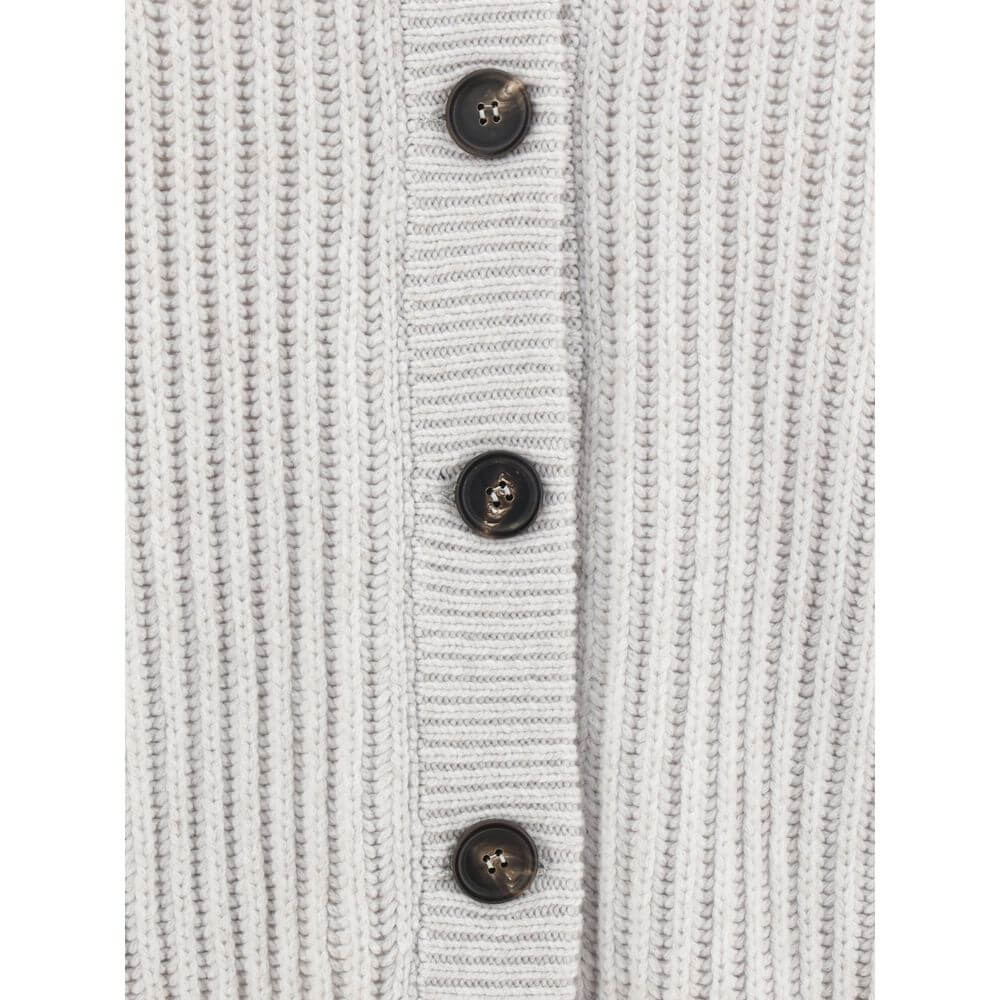 Close-up of Brunello Cucinelli White Cashmere Cardigan with ribbed texture and contrasting buttons.