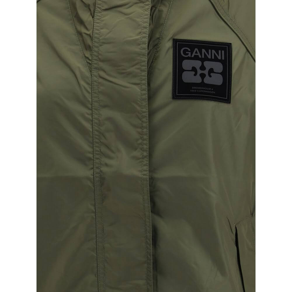 Ganni Green Nylon Shell Jacket with hood, front zipper, side pockets, and GANNI logo patch, waterproof and contemporary style.