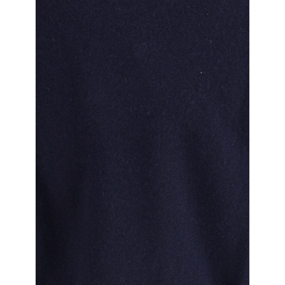 Extreme Cashmere Blue Cashmere Cashmere Sweater - close-up of fabric texture, showcasing luxurious knit material in deep blue shade.