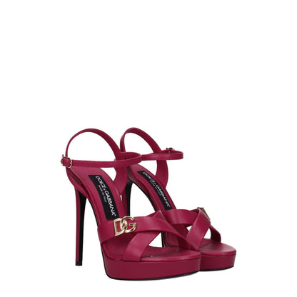 Dolce & Gabbana Pink Leather Platform Sandals with buckle closure and high heel, featuring gold side logo on fuchsia leather.