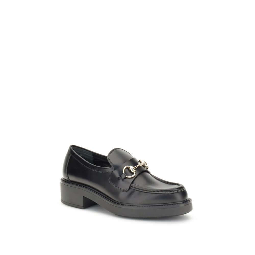 Gucci Black Calf Leather Bos Taurus Slip-On Loafers with horsebit detail, round toe, and block heel for a sophisticated look.