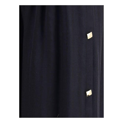 Close-up of Kristina Ti Black Fleece Wool Long Skirt with golden geometric buttons and elegant design.