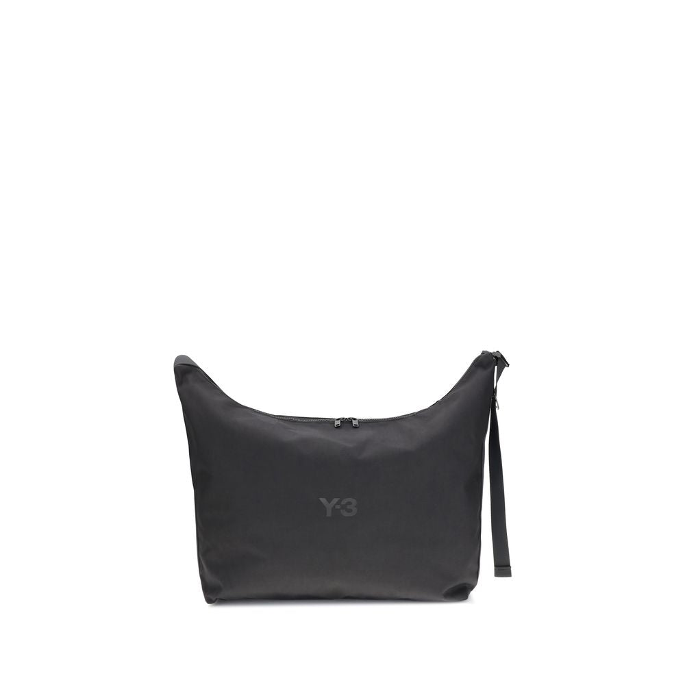 Y-3 Black Polyamide Shoulder Bag with adjustable strap and zip closure, featuring a printed logo on the front, designed for everyday use.