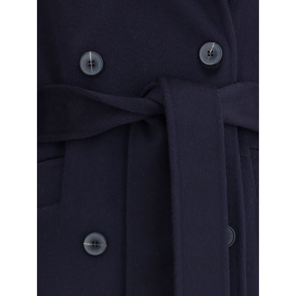 Close-up of Dynamis Studio Blue Wool Coat with double-breasted buttons and tied belt enhancing silhouette.