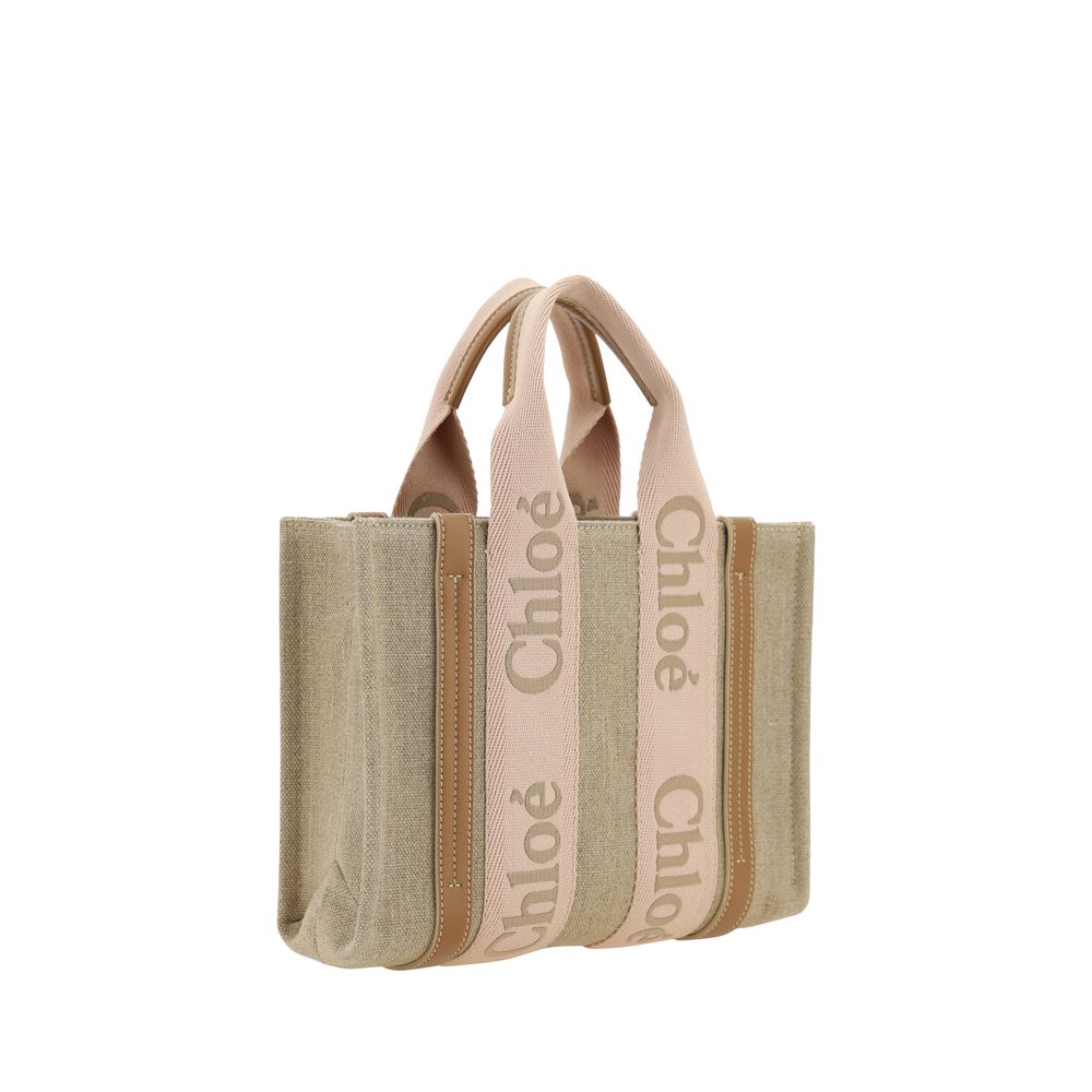 Chloé Beige Linen Handbag with leather details and double flat handles, featuring an adjustable shoulder strap and elegant design.