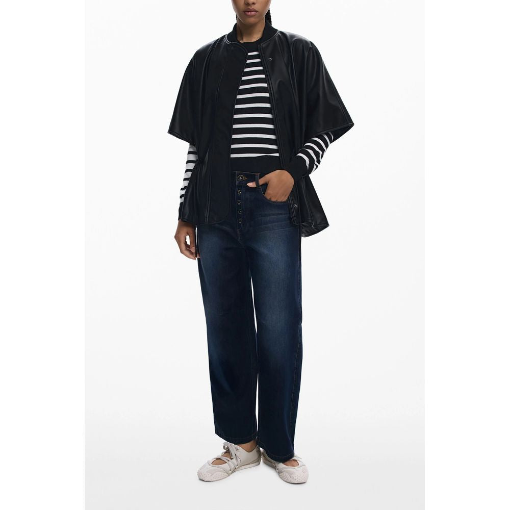 Model wearing Desigual Black Polyethylene Women Poncho with stripes and jeans, featuring a drawstring waist and embossed print.