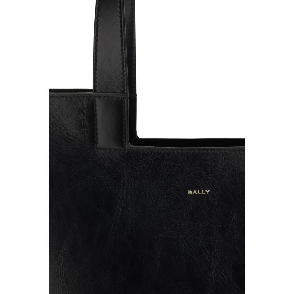 Close-up of Bally Black Calf Leather Bos Taurus Shoulder Bag with gold-laminated logo and minimalist design, autumn-winter accessory.