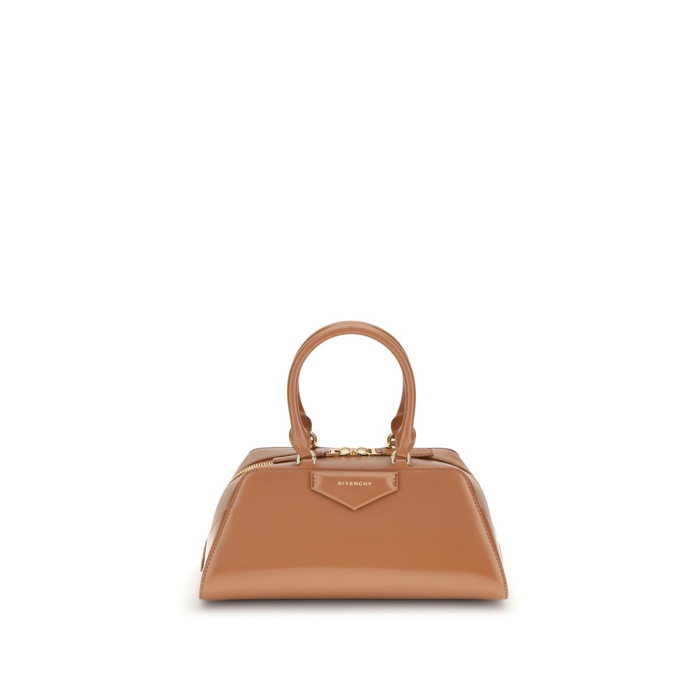 Givenchy Brown Calf Leather Bos Taurus Handbag with elegant design and embossed logo. Featuring structured silhouette and adjustable strap.