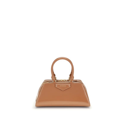 Givenchy Brown Calf Leather Bos Taurus Handbag with elegant design and embossed logo. Featuring structured silhouette and adjustable strap.