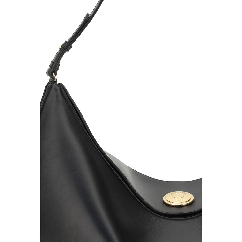 Close-up of Jacquemus Black Calf Leather Bos Taurus Shoulder Bag with engraved snap button and slim strap.