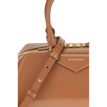 Close-up of Givenchy Brown Calf Leather Bos Taurus Handbag with embossed logo and elegant design.