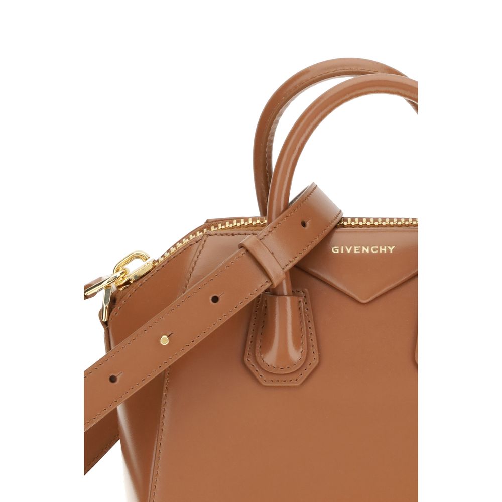 Close-up of Givenchy Brown Calf Leather Bos Taurus Handbag showing shiny leather, logo, and strap details.