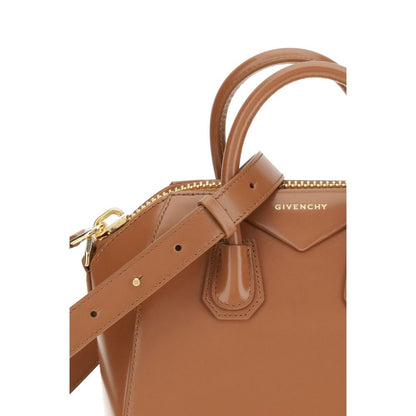 Close-up of Givenchy Brown Calf Leather Bos Taurus Handbag showing shiny leather, logo, and strap details.