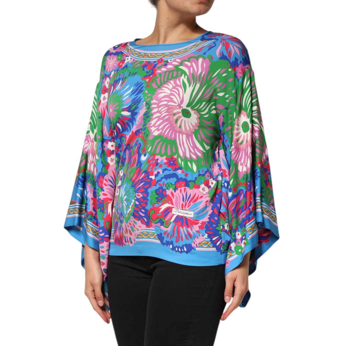 Dolce & Gabbana Multicolor Floral Printed Tunic Blouse Top on model, showcasing vibrant floral patterns and elegant draping silhouette.