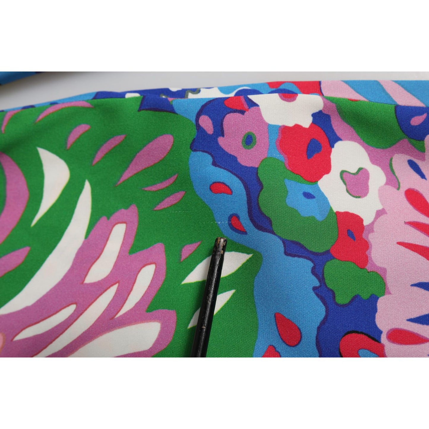 Close-up of Dolce & Gabbana Multicolor Floral Printed Tunic Blouse Top with vibrant fabric detail.