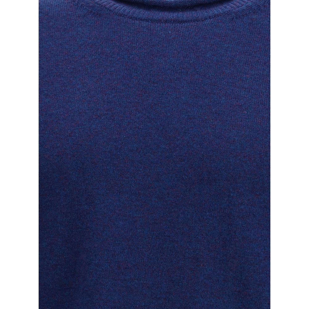 Comme Des Garçons Blue Wool Sweatshirt with ribbed knit texture and round neckline, showcasing elegant long sleeves, AW25 collection.