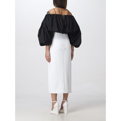 Back view of a model wearing a PINKO White Polyester Midi Skirt with stylish thigh slit, showcasing a chic and elegant look.