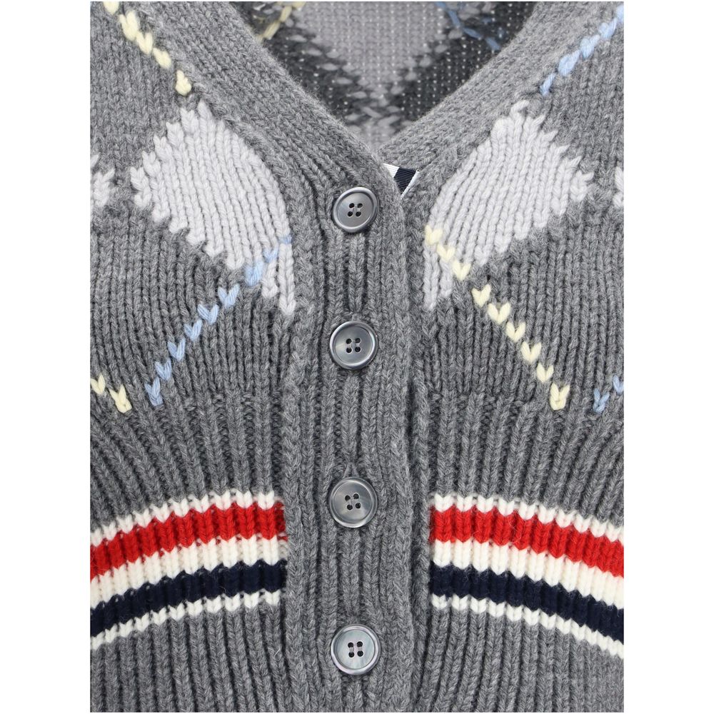 Close-up of Thom Browne Gray Fleece Wool Cardigan's argyle pattern, buttons, and V-neck design. Crafted from soft merino wool for AW25 season.