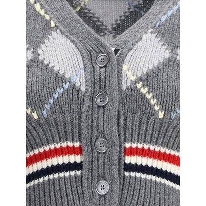 Close-up of Thom Browne Gray Fleece Wool Cardigan's argyle pattern, buttons, and V-neck design. Crafted from soft merino wool for AW25 season.
