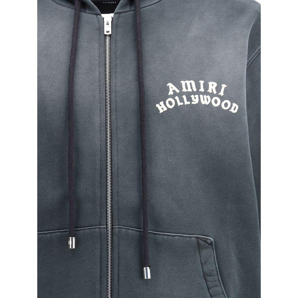 Amiri Black Cotton Sweatshirt featuring "Hollywood" motif, kangaroo pocket, and zip closure, AW25 streetwear style, regular fit.