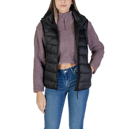 Woman wearing B.Young Black Nylon Sleeveless Jacket, showcasing quilted design and front zip closure for style and wind protection.