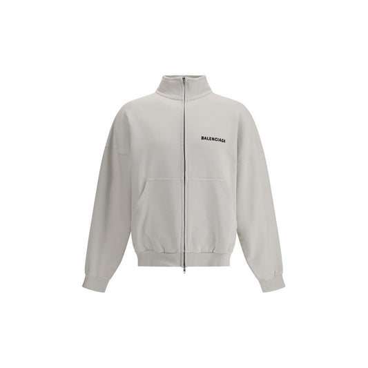 Balenciaga White Cotton Sweatshirt with worn effect and patch pockets, showcasing brand's bold style.