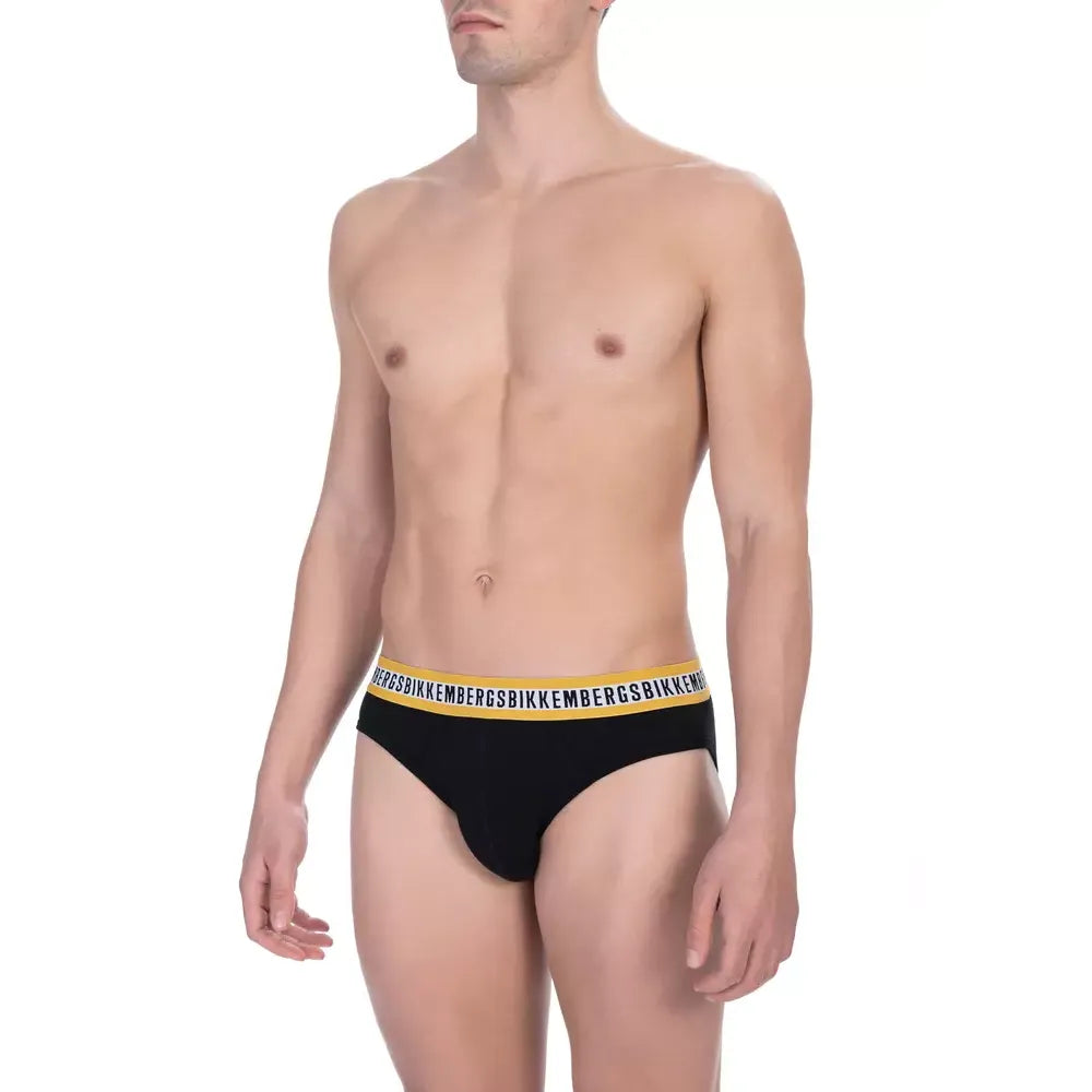 Man wearing Bikkembergs Black Cotton Men Brief Pack, showcasing sleek design and comfort in classic black.