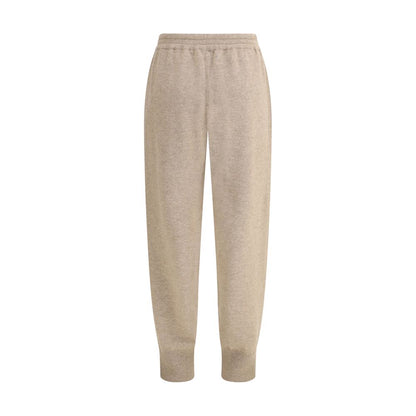 Brunello Cucinelli Beige Cashmere Pants with elastic waistband and side pockets, showcasing a tapered silhouette for casual wear.