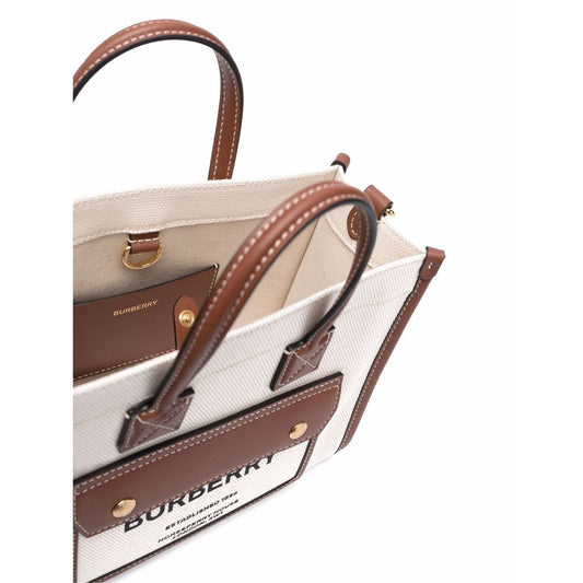 Burberry mini tote bag in cream and brown cotton, featuring logo print, gold-tone hardware, and adjustable strap, top view.