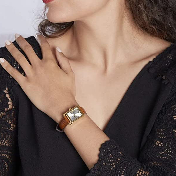 Woman wearing CASIO COLLECTION Mod. TANK. LEATHER - ARGENTEE wristwatch with quartz movement, SS IP Gold case, leather strap, and mineral dial.