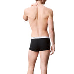 Male model wearing Calvin Klein Underwear Black Cotton Boxer with logo waistband, showcasing modern low-rise style and perfect fit.