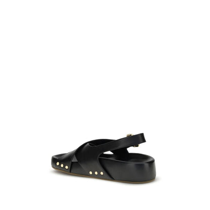 Chloé Mae Sandals with black calfskin, gold studs, and Paddington buckle, showing back and side view of sandal with crossed straps.