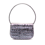 Diesel 1DR Tote Bag in blue, with embossed crocodile effect, featuring a foldover top, single handle, and detachable shoulder strap.