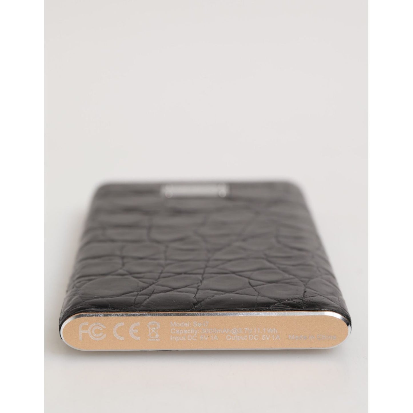 Dolce & Gabbana Black Leather Exotic 3000mAh Power Bank Charger USB with luxurious textured design, sleek and stylish for on-the-go charging.