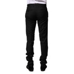 Back view of Dolce & Gabbana Black Wool Formal Men Slim Pants, featuring two back pockets and elegant fit in 100% virgin wool.