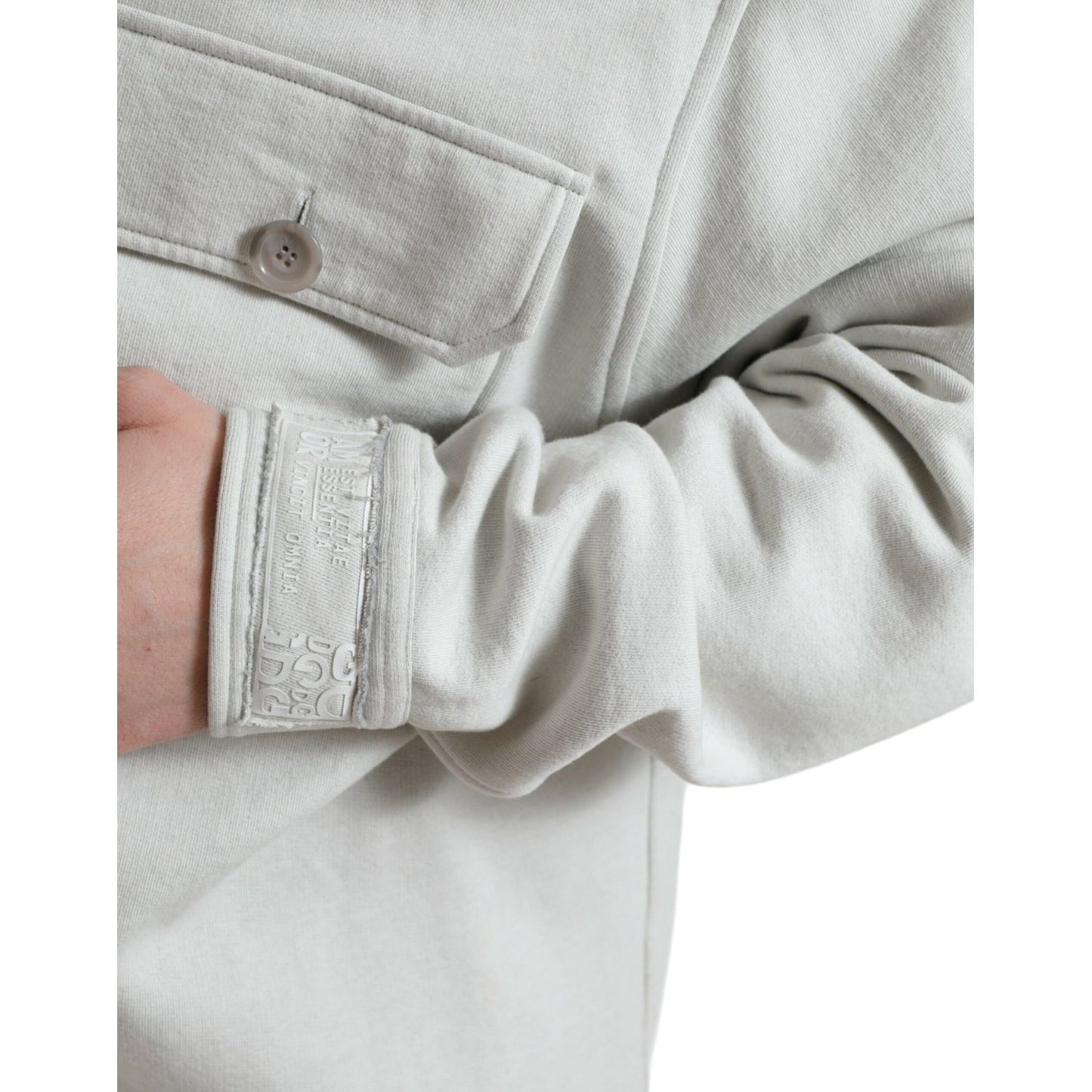 Close-up of Dolce & Gabbana Grey Cotton Button Down Collared Coat Jacket featuring detailed button and pocket stitching.