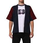 Man wearing a Dolce & Gabbana Multicolor Striped Cotton Men Crew Neck T-shirt with short sleeves, showcasing bold design.