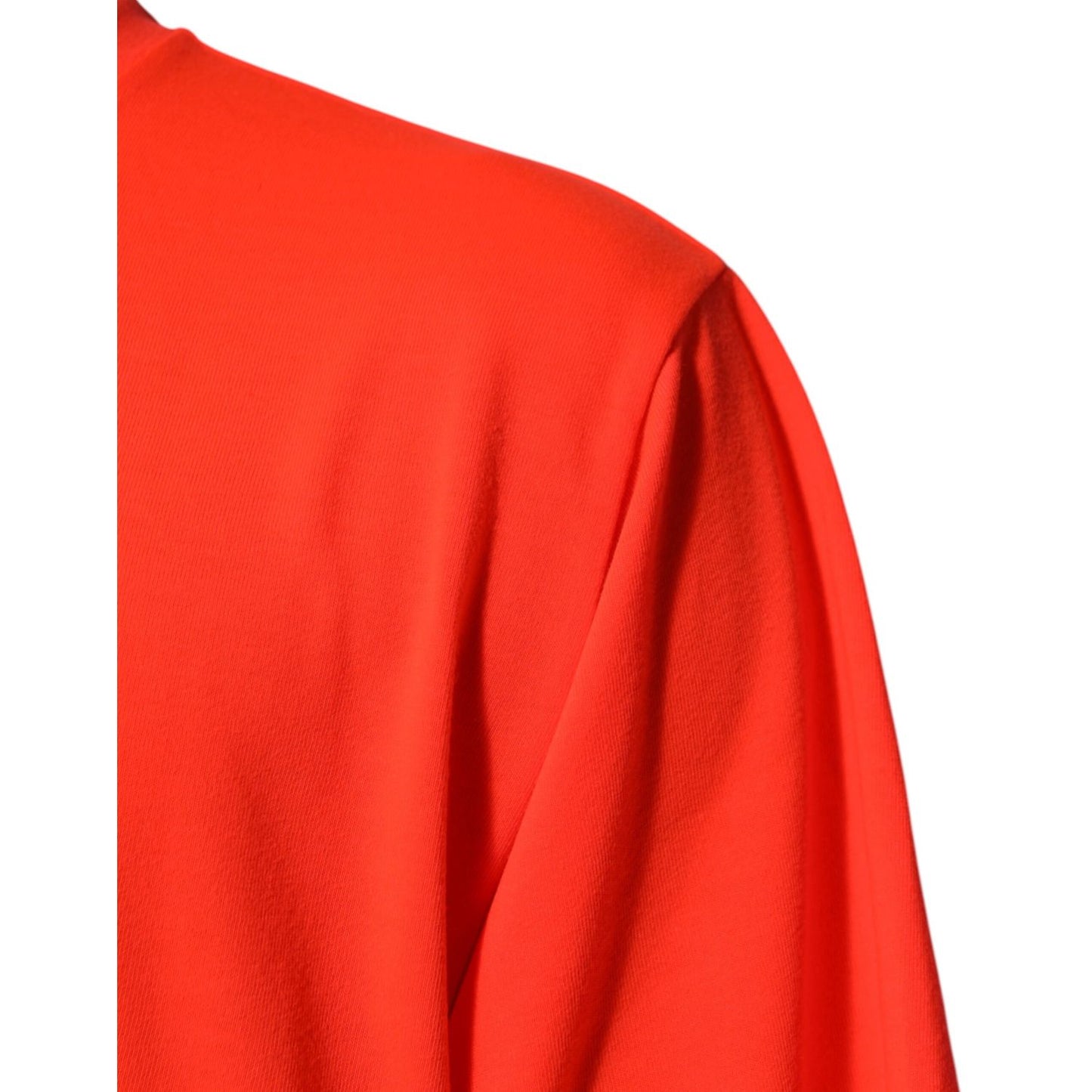 Close-up of Dolce & Gabbana Neon Orange Polyester Men Crew Neck T-shirt showcasing smooth fabric and vibrant color in shoulder area.
