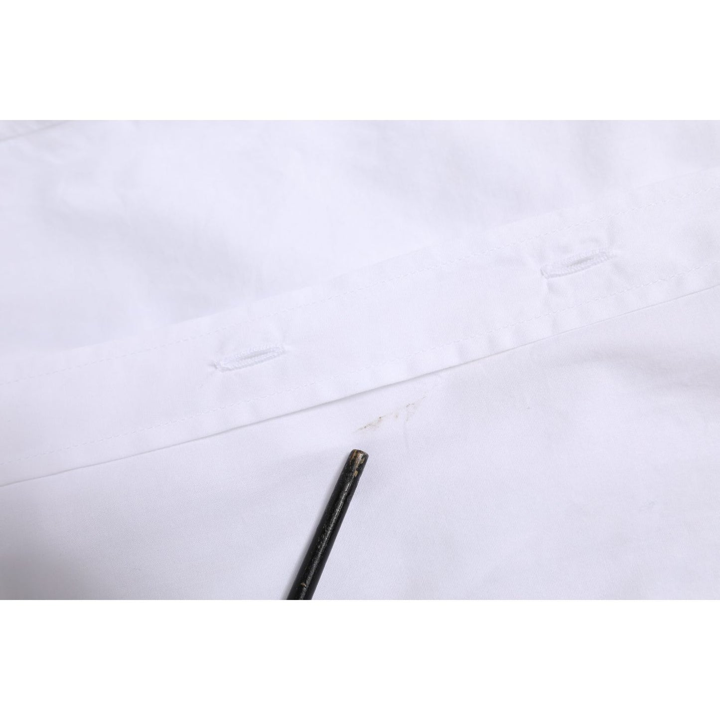 Close-up of Dolce & Gabbana White Collared Long Sleeves Dress Shirt Top, highlighting buttonhole stitching detail.