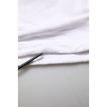Close-up of fabric detail on Dolce & Gabbana White Cotton Cargo Trousers Logo Patch Pants showing high-quality cotton material.