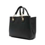 Emporio Armani MyEA small shopping bag in black faux leather with grained texture, gold-tone hardware, and adjustable logo-jacquard strap.