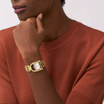 Lady wearing FOSSIL Mod. HARWELL wristwatch with 28mm case, showcased in official packaging.